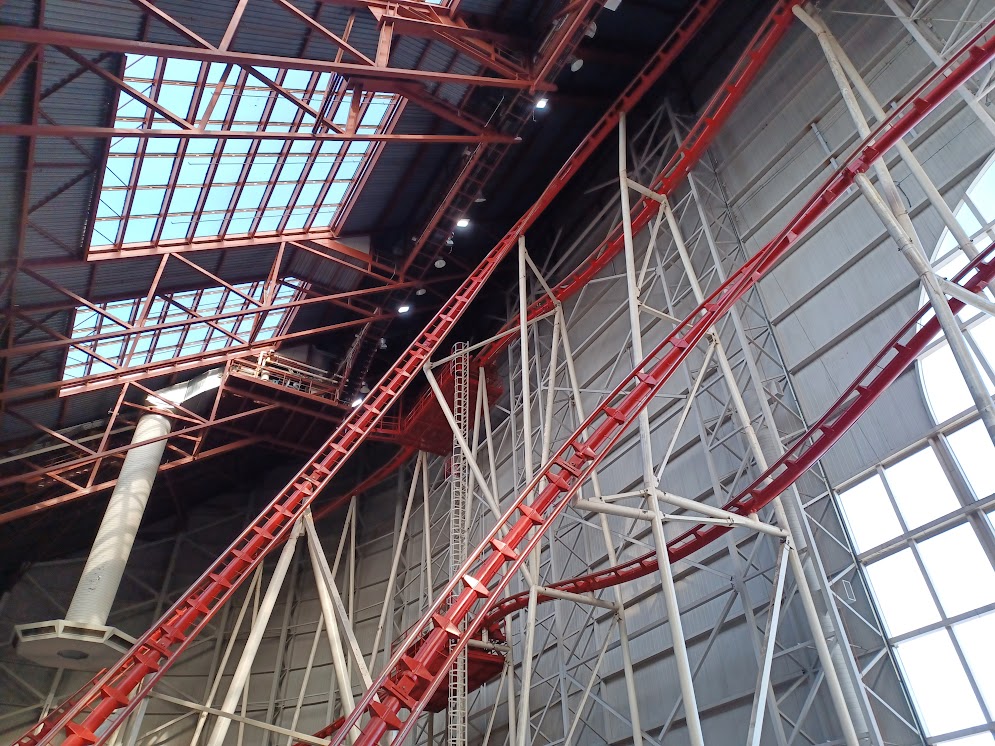 A photo of the Mindbender's left side, which is mostly of tracks weaving and climbing up to the roof.