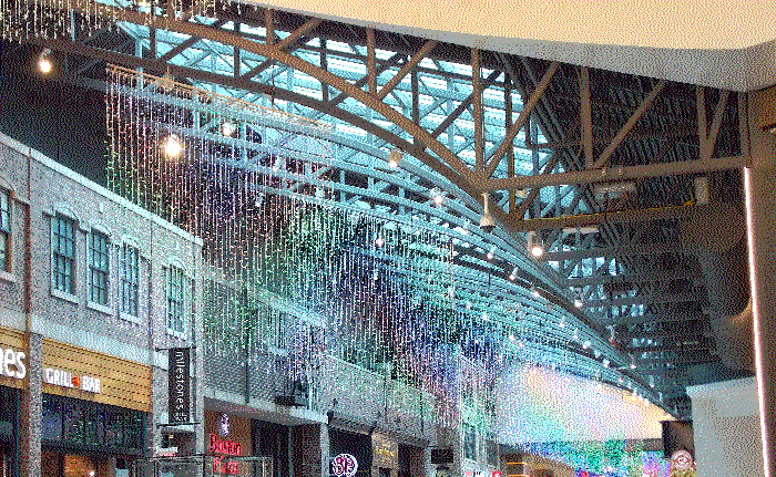 A long line of those rainbow curtain lights leading down the hallway.